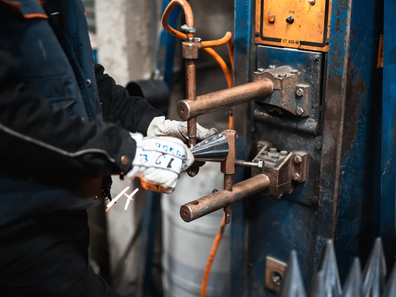 Operator at work on a machine in the Metal-M workshop